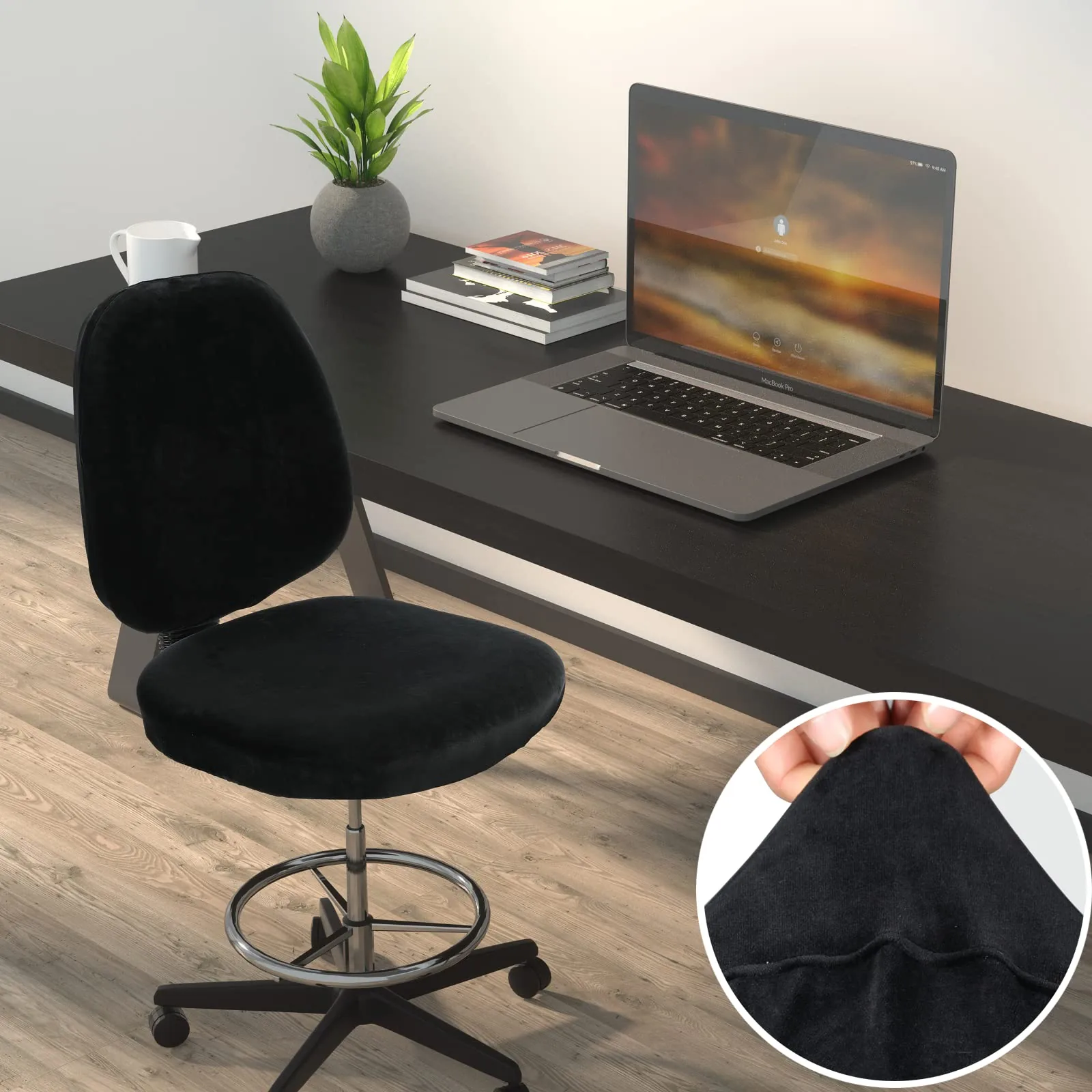 Black armless office chair at a desk fitted with a soft velvet stretch cover